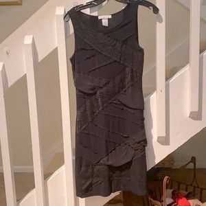 Formfitting black tank dress, lace detail front